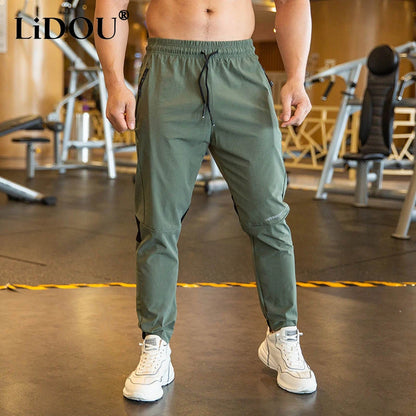 2024 Summer Thin Style Ice Silk Fabric Motion Trousers Man Solid Color Elastic Waist Quick Drying Loose Bodybuilding Sweatpants